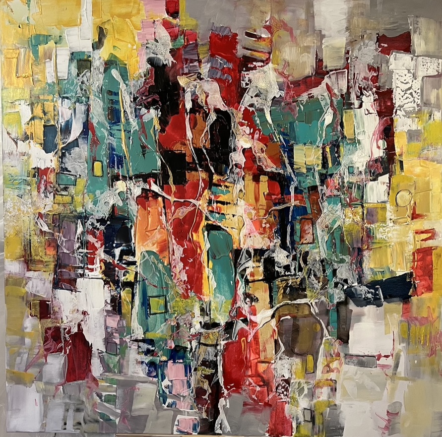 Paul Ygartua in his studio beneath a large portrait painting